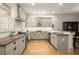 Bright kitchen showcasing granite countertops, stainless appliances, and a stylish design at 719 Hammond Dr, Woodstock, GA 30188