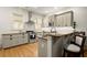 Well-lit kitchen featuring granite countertops, stainless steel appliances, and abundant cabinet space at 719 Hammond Dr, Woodstock, GA 30188