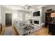 Bright living room with hardwood floors, fireplace, and abundant natural light at 719 Hammond Dr, Woodstock, GA 30188