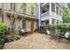 Charming stone patio with outdoor seating, perfect for entertaining or relaxing at 719 Hammond Dr, Woodstock, GA 30188
