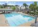 Resort-style neighborhood pool with lounge seating, tables, and cabana at 719 Hammond Dr, Woodstock, GA 30188