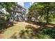 Picturesque backyard with lush greenery, wooden fence, and a deck at 737 Dushea Nw Ct, Kennesaw, GA 30144