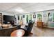 Spacious basement living room with wood flooring, ample seating, and natural light, perfect for entertaining at 737 Dushea Nw Ct, Kennesaw, GA 30144