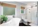 Bathroom showcasing soaking tub, walk-in shower, and natural light for a spa-like experience at 737 Dushea Nw Ct, Kennesaw, GA 30144