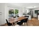 Dining area featuring a wood table and chairs with access to a deck at 737 Dushea Nw Ct, Kennesaw, GA 30144