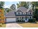 Beautiful two-story home with a two car garage, complemented by a welcoming front porch and manicured lawn at 737 Dushea Nw Ct, Kennesaw, GA 30144