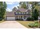 Charming two-story home with a welcoming front porch and well-maintained landscaping at 737 Dushea Nw Ct, Kennesaw, GA 30144