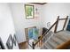 Bright foyer with hardwood floors, staircase, and a front door with a wreath at 737 Dushea Nw Ct, Kennesaw, GA 30144