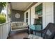 Inviting front porch with a cozy porch swing, ideal for relaxing and enjoying the outdoors at 737 Dushea Nw Ct, Kennesaw, GA 30144