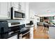 Modern kitchen features stainless steel appliances, granite countertops, and hardwood floors at 737 Dushea Nw Ct, Kennesaw, GA 30144