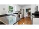 Bright kitchen with granite countertops, stainless steel appliances, and hardwood floors at 737 Dushea Nw Ct, Kennesaw, GA 30144