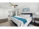 Spacious bedroom featuring ample natural light, tray ceilings, and ensuite bath access at 737 Dushea Nw Ct, Kennesaw, GA 30144