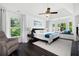 Bright bedroom features tray ceilings, bay windows, and a cozy seating area for relaxing at 737 Dushea Nw Ct, Kennesaw, GA 30144