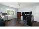 Bright office featuring hardwood floors, neutral paint, a ceiling fan and plenty of natural light from the window at 737 Dushea Nw Ct, Kennesaw, GA 30144