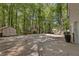 Large backyard featuring a basketball court, storage shed, and mature trees at 1819 Walker Ridge Sw Dr, Marietta, GA 30064