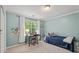 Serene bedroom with a single bed, a desk under the window, and bright natural light at 1819 Walker Ridge Sw Dr, Marietta, GA 30064