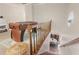View from the landing of the bonus room, looking down into an eat-in kitchen at 1819 Walker Ridge Sw Dr, Marietta, GA 30064