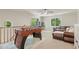 Spacious bonus room with a foosball table, comfy seating, and natural light from windows overlooking the yard at 1819 Walker Ridge Sw Dr, Marietta, GA 30064