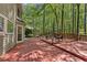 Spacious wood deck overlooking a lush, wooded backyard with outdoor seating at 1819 Walker Ridge Sw Dr, Marietta, GA 30064