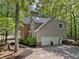 Exterior elevation of a two-story home featuring a two-car garage and neutral siding at 1819 Walker Ridge Sw Dr, Marietta, GA 30064