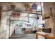 Functional garage with organized storage solutions, overhead racks, and a workbench area at 1819 Walker Ridge Sw Dr, Marietta, GA 30064