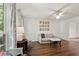 Cozy living room featuring white walls, decorative curtains, and hardwood floors at 1819 Walker Ridge Sw Dr, Marietta, GA 30064