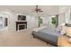 Spacious main bedroom features a fireplace, sitting area, and windows that overlook the backyard at 1819 Walker Ridge Sw Dr, Marietta, GA 30064
