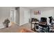 Bedroom with desk, chair, bookcase and entry to other rooms at 206 Prescott St, Locust Grove, GA 30248