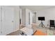 Bedroom with printer, tv on a tripod and doors leading to other rooms at 206 Prescott St, Locust Grove, GA 30248