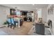 Eat-in kitchen with stainless steel appliances, granite countertops, modern cabinetry, and a glass dining table at 206 Prescott St, Locust Grove, GA 30248