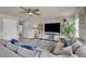 Spacious living room with stylish furniture, large TV, and inviting decor at 206 Prescott St, Locust Grove, GA 30248