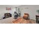 Cozy office space with neutral walls, contemporary furnishings, and a warm-toned area rug on carpet at 206 Prescott St, Locust Grove, GA 30248