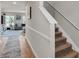 Hallway with staircase leading to the upper level and view of the living room at 206 Prescott St, Locust Grove, GA 30248