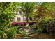 Inviting backyard retreat with lush landscaping, flowering shrubs, and comfortable seating at 217 Knob Hills Cir, Decatur, GA 30030