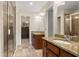 Bathroom with granite countertops, wooden cabinets, glass-enclosed shower, and access to a closet or bedroom at 217 Knob Hills Cir, Decatur, GA 30030