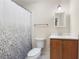 Simple bathroom featuring a shower-tub combination, toilet, and vanity with a white countertop at 217 Knob Hills Cir, Decatur, GA 30030
