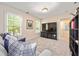 Bonus room with a comfy couch, television, and neutral walls and carpet at 217 Knob Hills Cir, Decatur, GA 30030