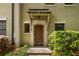 Exterior shot of the front entrance of townhome with a covered entryway and a wooden front door at 217 Knob Hills Cir, Decatur, GA 30030