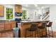 Open concept kitchen featuring wood cabinets, granite countertops and island seating with views of the backyard at 217 Knob Hills Cir, Decatur, GA 30030