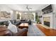 Cozy living room with a fireplace, hardwood floors, and large windows at 217 Knob Hills Cir, Decatur, GA 30030