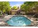 Community pool featuring a tanning deck and lounge area surrounded by mature landscaping at 217 Knob Hills Cir, Decatur, GA 30030