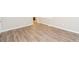 This room features wood-look flooring, neutral walls, and natural light from a window at 4391 Sandy Plains Rd, Marietta, GA 30066