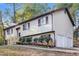 Charming two-story home with a two-car garage, nice landscaping, and a cozy front porch at 4391 Sandy Plains Rd, Marietta, GA 30066