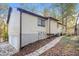 Back exterior elevation with yard and garage doors at 4391 Sandy Plains Rd, Marietta, GA 30066