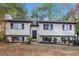 A beautiful two-story home featuring a well-maintained lawn and classic architectural details at 4391 Sandy Plains Rd, Marietta, GA 30066