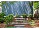Charming backyard patio with outdoor seating, surrounded by lush greenery, ideal for relaxing and enjoying the outdoors at 132 Olympic Pl, Decatur, GA 30030