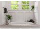Bright bathroom with standalone tub and wainscoting at 132 Olympic Pl, Decatur, GA 30030