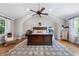 Spacious bedroom with vaulted ceilings, decorative rug, and large windows at 132 Olympic Pl, Decatur, GA 30030