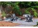 Inviting firepit area with comfortable seating, perfect for cozy evenings and outdoor gatherings with friends at 132 Olympic Pl, Decatur, GA 30030