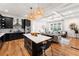 Modern kitchen with black cabinets, stainless steel appliances, and island seating at 132 Olympic Pl, Decatur, GA 30030